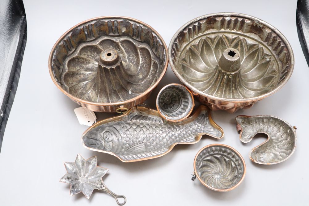 Seven 19th century copper jelly moulds